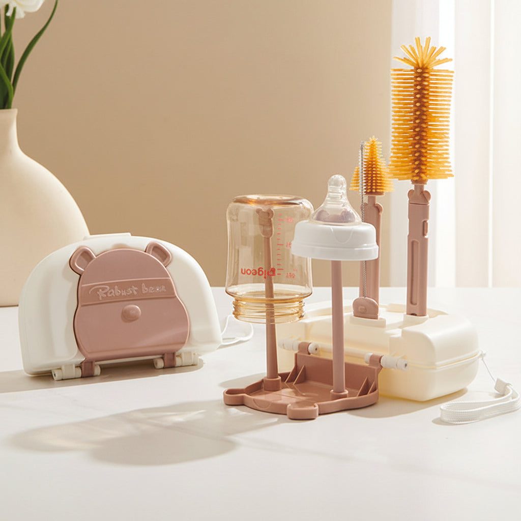 Baby bottle and accessories set on a white surface with a beige wall background.