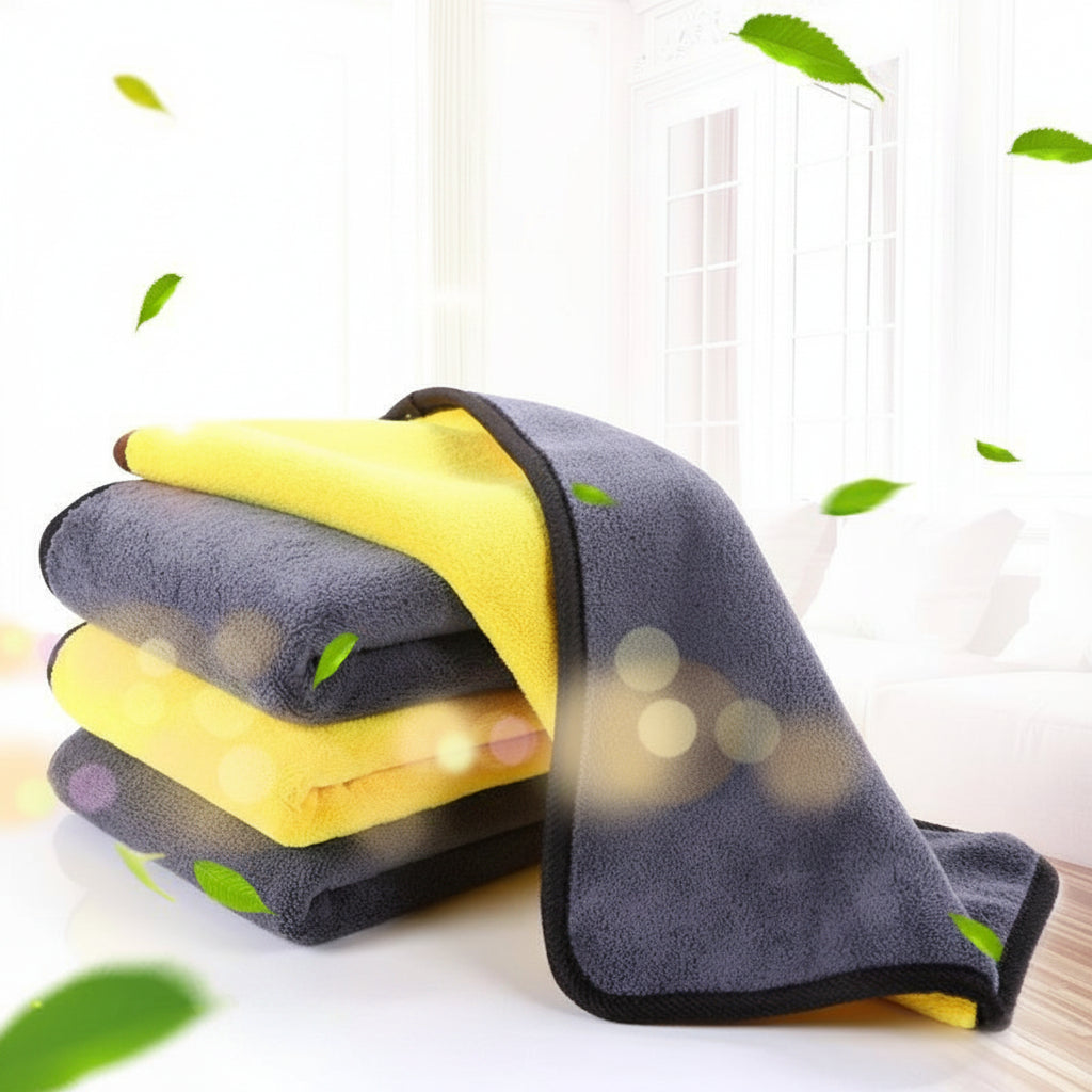 Gray and yellow microfiber towels with green leaves on a white background