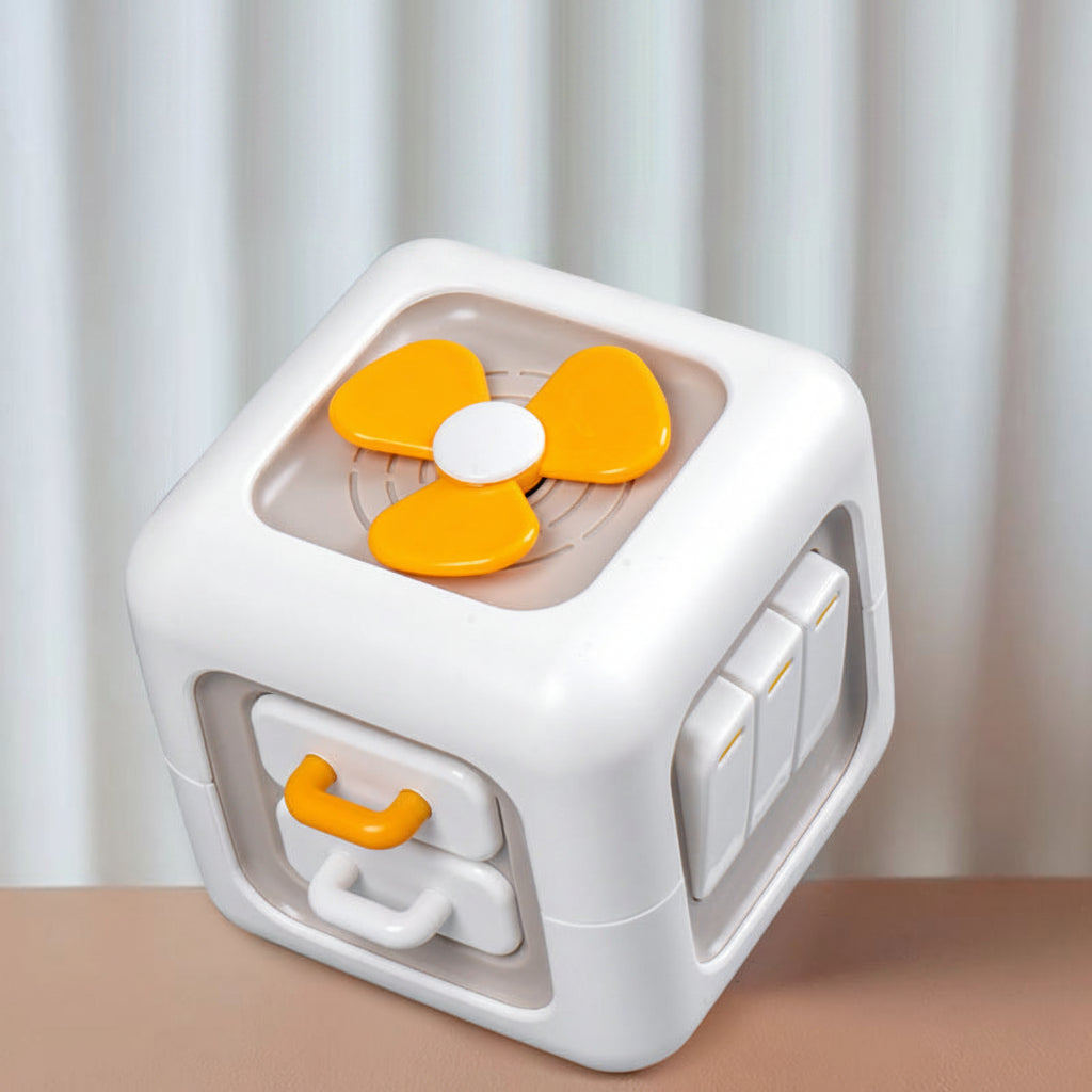 Toy cube with orange and white design on a neutral background