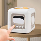 Cube-shaped mirror with screen and buttons on a wooden surface, with text in Chinese.