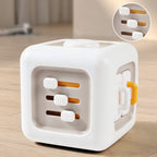 White busy cube with orange accents on a wooden surface, featuring text in Chinese.